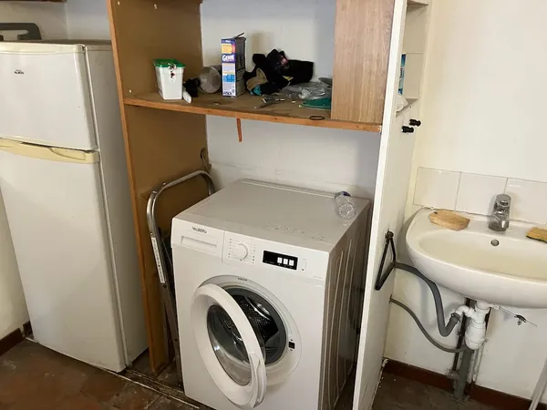 The laundry room with washing machine